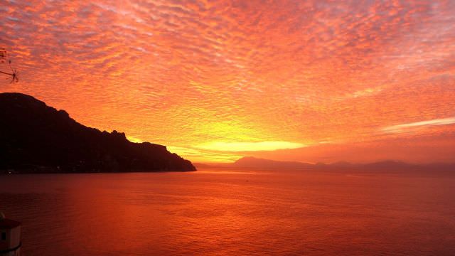 There are often these breathtaking sunrise views from our villa in the hills above the towns of Amalfi and Atrani. 